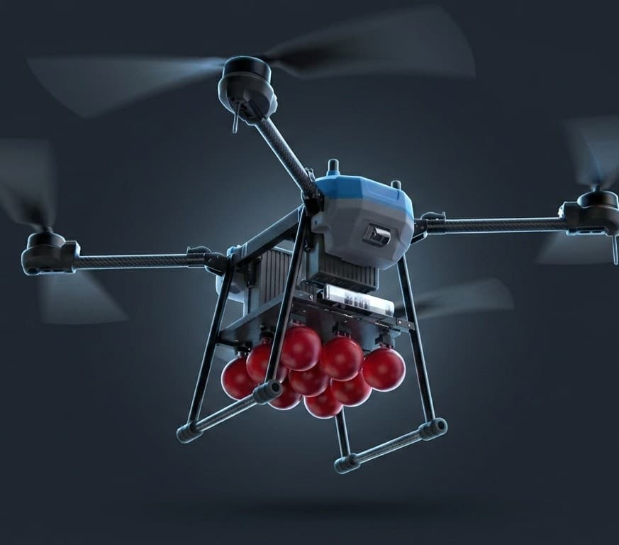 Baymax 100 heavy firefighting drone carrying a cluster of red extinguishing balls